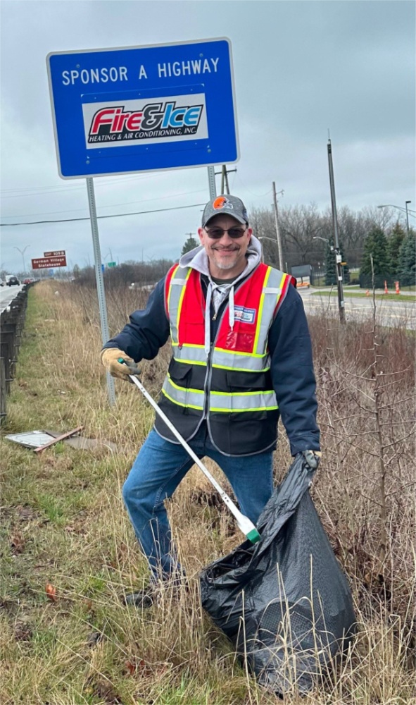 Josh cleaning up trash