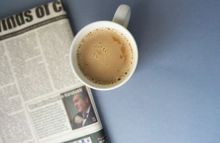 Coffee Cup and Newspaper