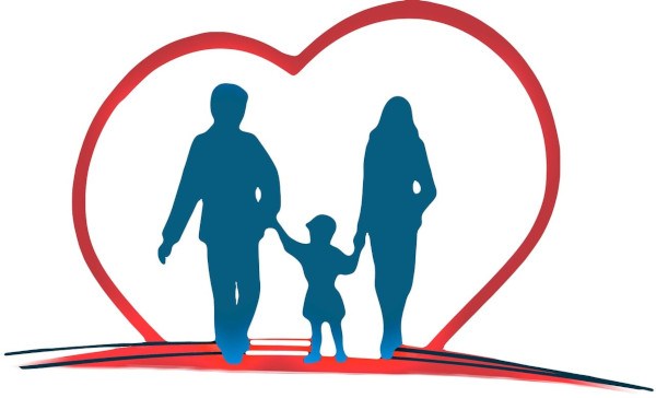 A silhouette of a man and a woman holding a child's hand in a heart