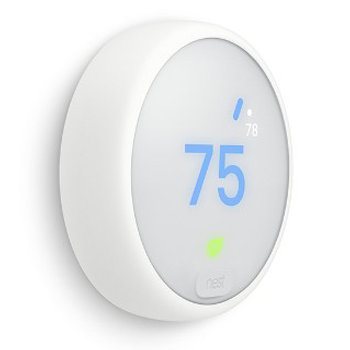 A white Google Nest Thermostat.